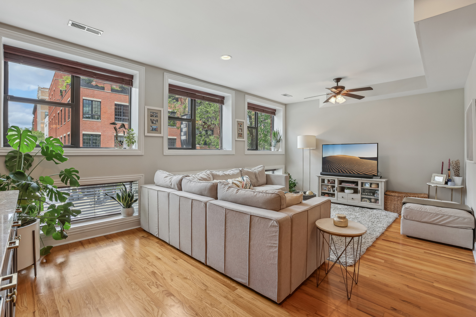 1025 West Madison Street, Unit 1 Chicago, IL 60607 - Photo 2 of 21 a living room with furniture and a flat screen tv