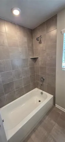 a spacious bathroom with a double vanity sink and a mirror