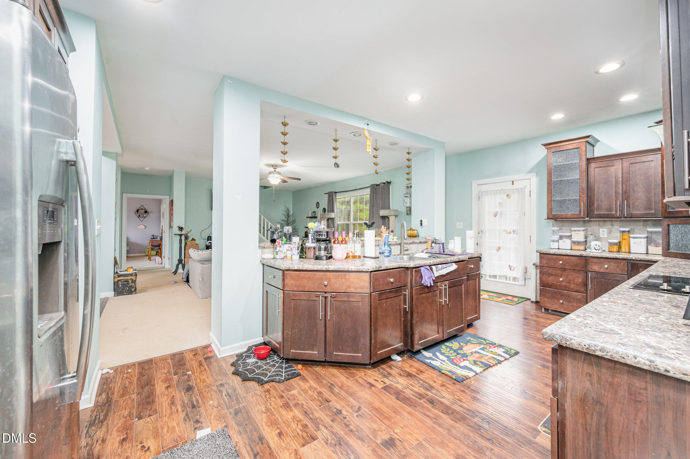 11801 Burlington Road Hurdle Mills, NC 27541 - Photo 11 of 32 a large white kitchen with wooden floor and a sink