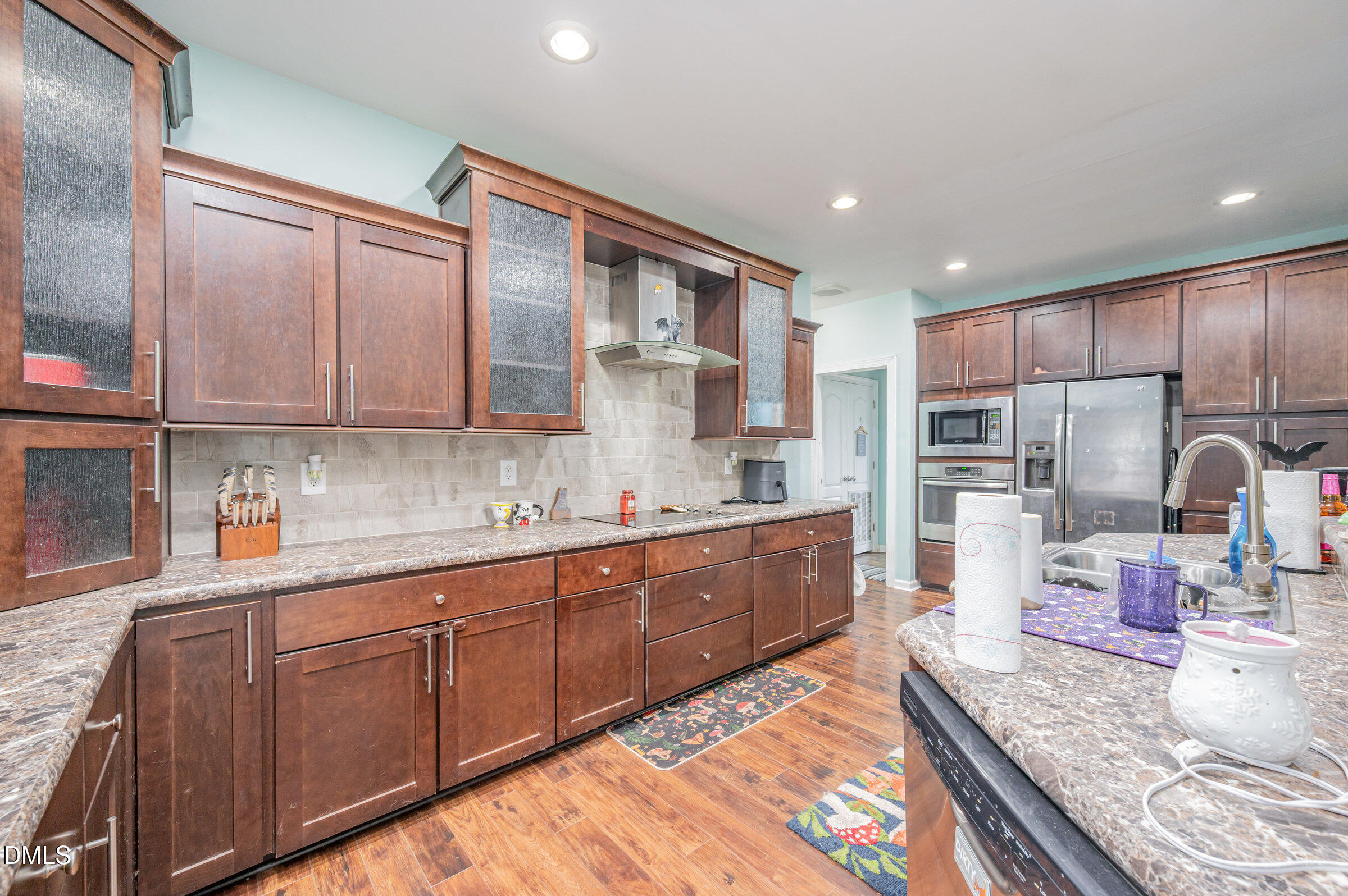 11801 Burlington Road Hurdle Mills, NC 27541 - Photo 12 of 32 a large kitchen with stainless steel appliances granite countertop a sink and cabinets