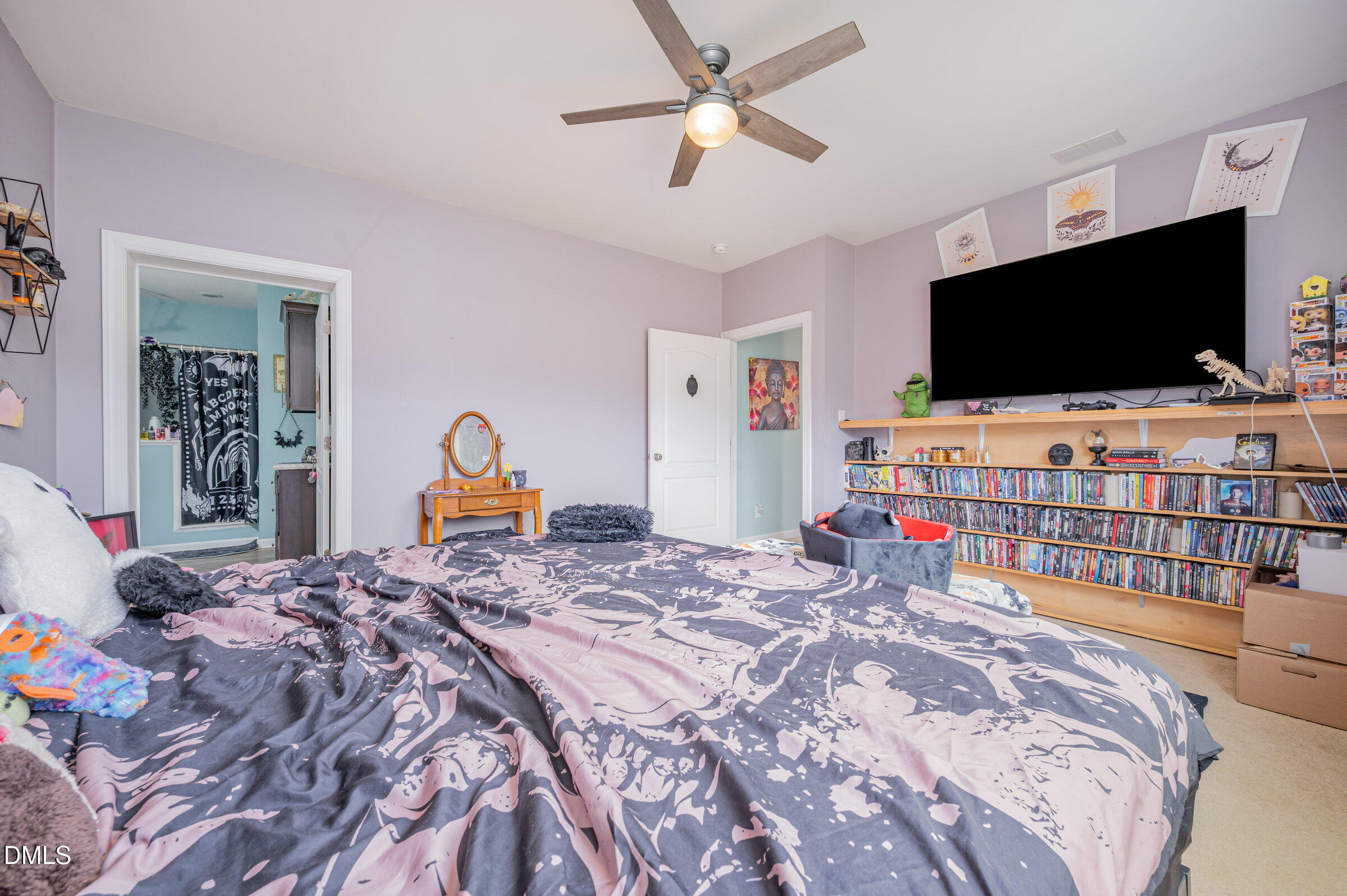 11801 Burlington Road Hurdle Mills, NC 27541 - Photo 16 of 32 a bedroom with bed and a flat screen tv