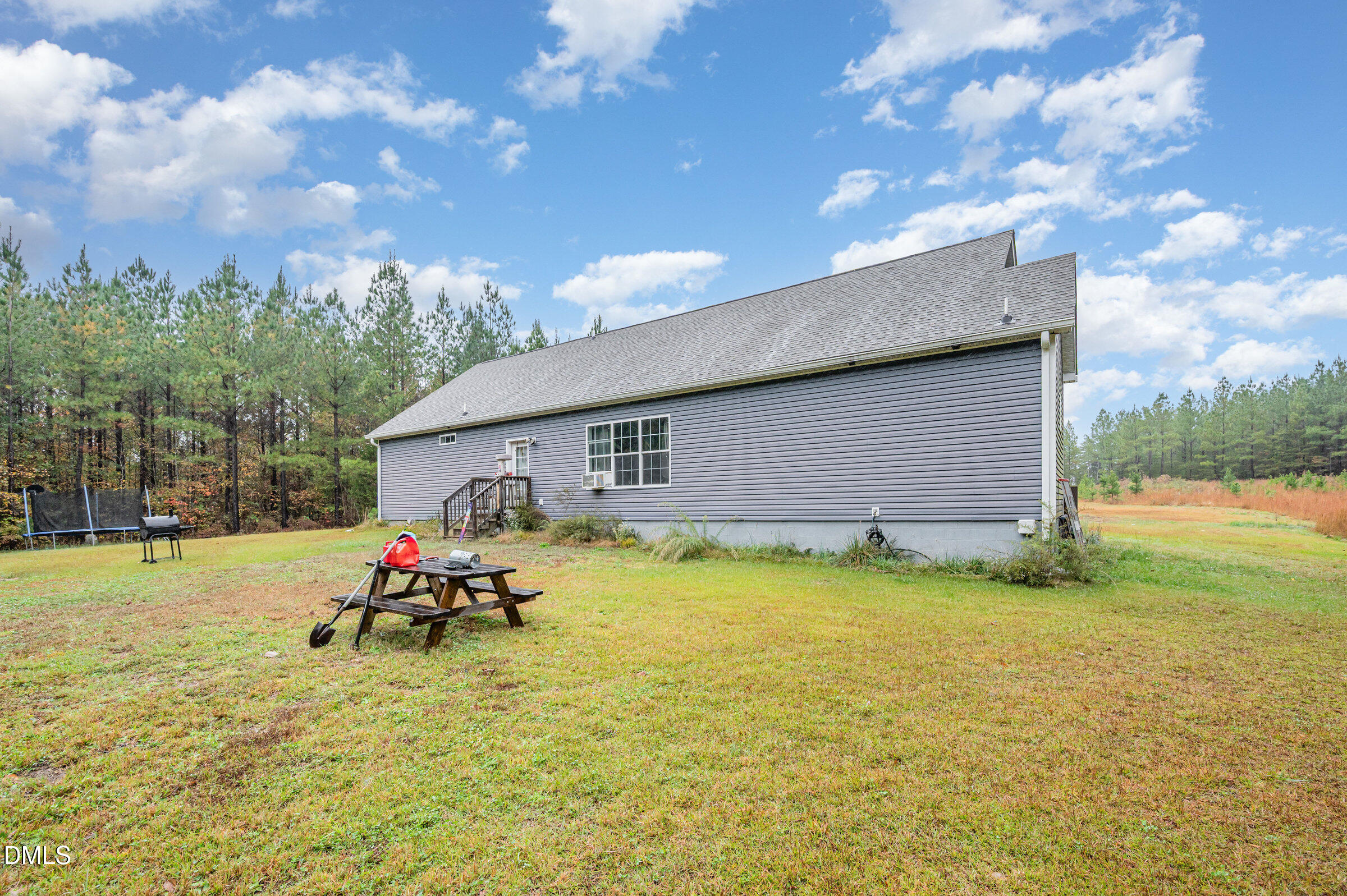 11801 Burlington Road Hurdle Mills, NC 27541 - Photo 23 of 32 a backyard of a house with table and chairs