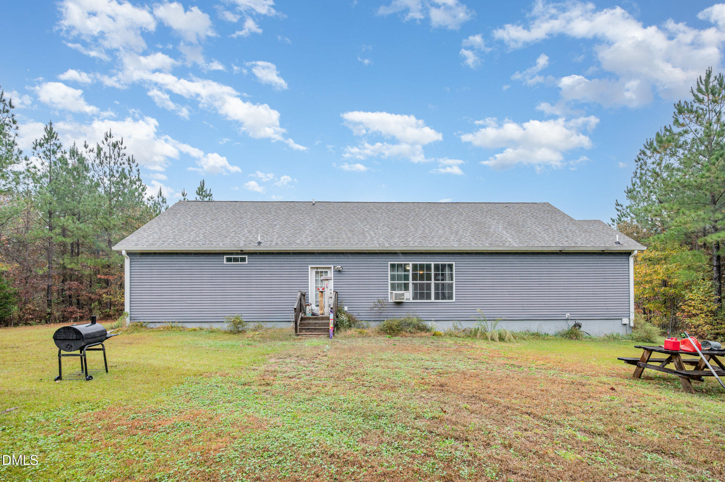 11801 Burlington Road Hurdle Mills, NC 27541 - Photo 24 of 32 a front view of a house with garden