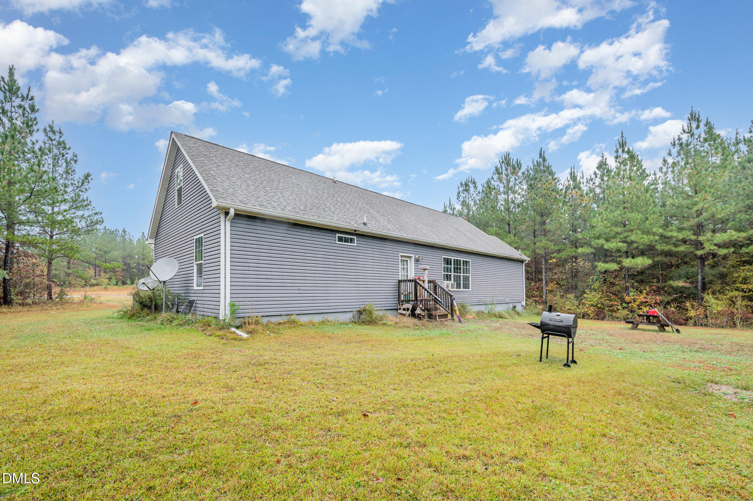 11801 Burlington Road Hurdle Mills, NC 27541 - Photo 25 of 32 a backyard of a house with table and chairs