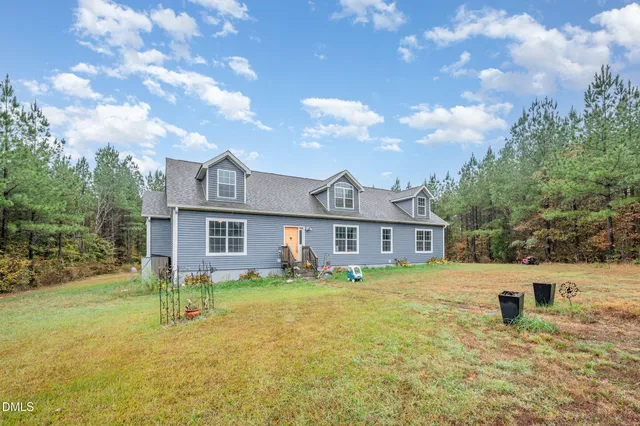 a view of a house with a big yard