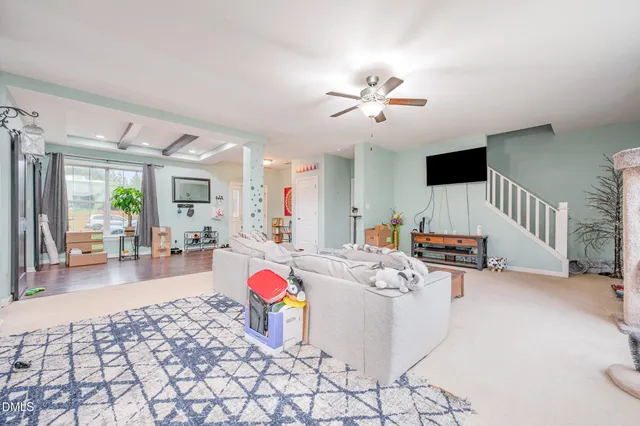 a living room with furniture and a table