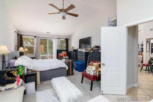 a living room with furniture fireplace and flat screen tv