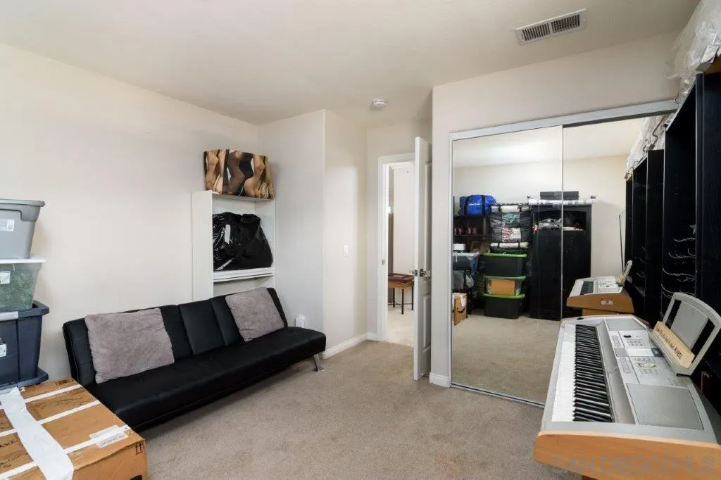 569 Inverlochy Drive Fallbrook, CA 92028 - Photo 25 of 46 a living room with furniture and a couch