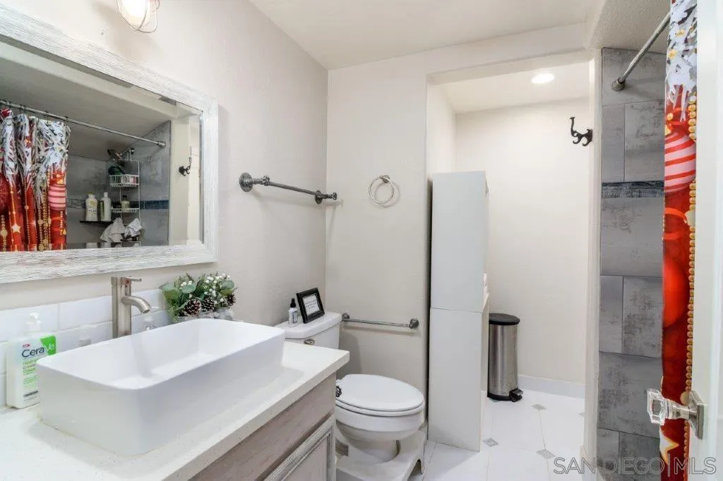 569 Inverlochy Drive Fallbrook, CA 92028 - Photo 27 of 46 a bathroom with a sink a toilet and shower