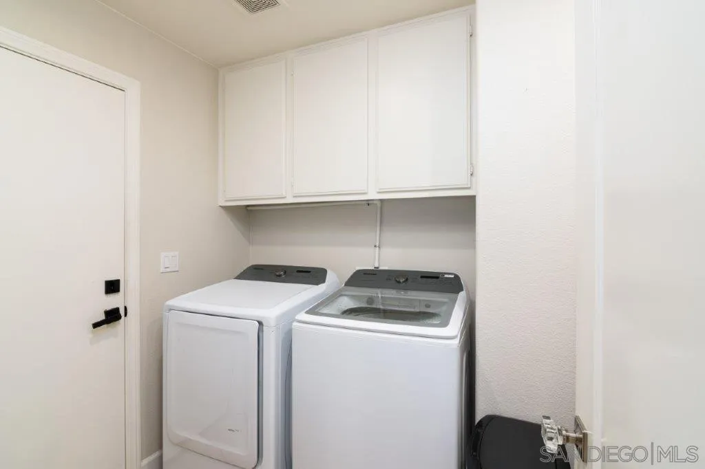 569 Inverlochy Drive Fallbrook, CA 92028 - Photo 28 of 46 a utility room with dryer and washer