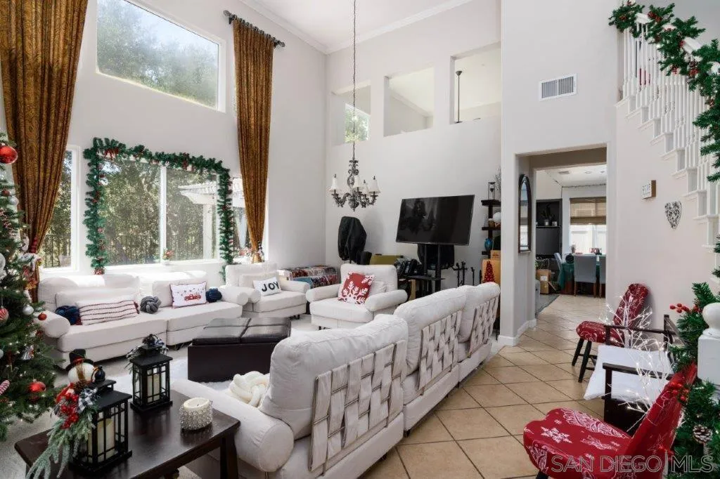 569 Inverlochy Drive Fallbrook, CA 92028 - Photo 7 of 46 a living room with furniture and a large window