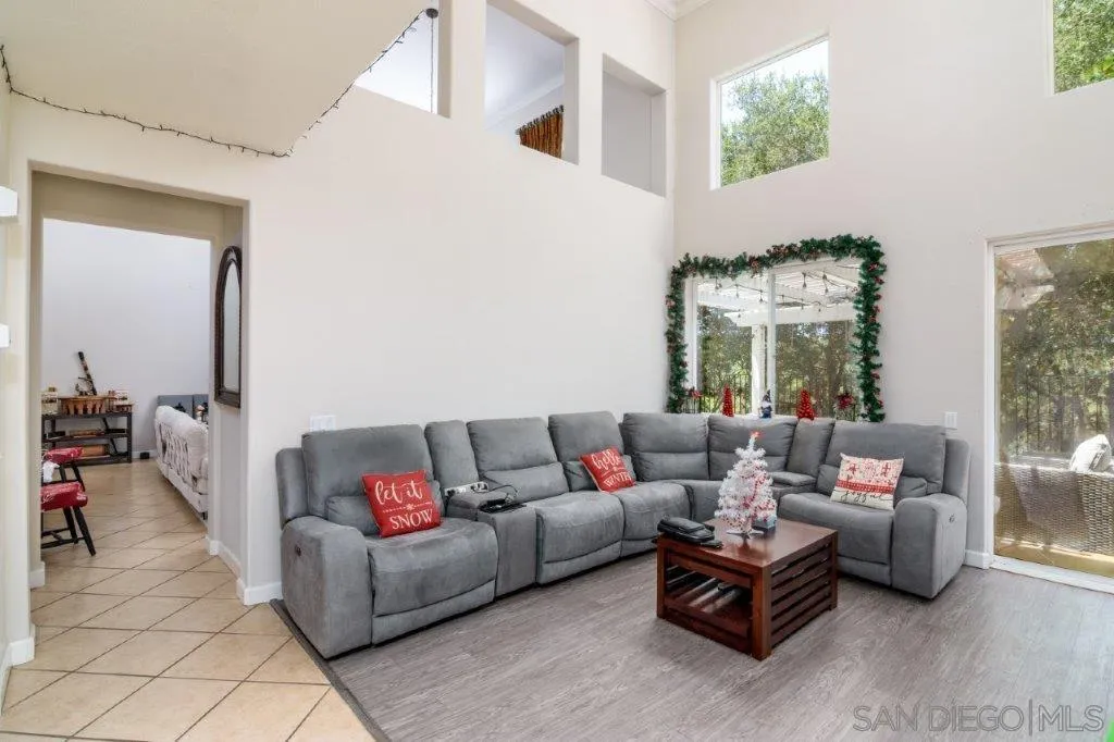 569 Inverlochy Drive Fallbrook, CA 92028 - Photo 8 of 46 a living room with furniture and a large window