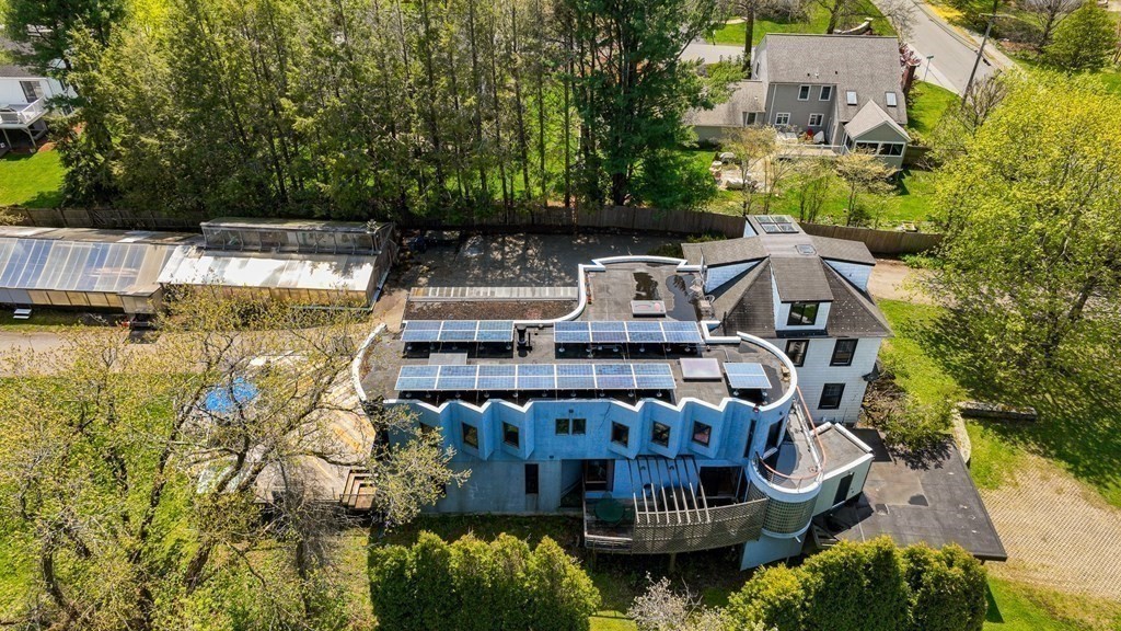 75 Kendall Road Lexington, MA 02421 - Photo 21 of 22 a view of a house with outdoor space and a lake view in back