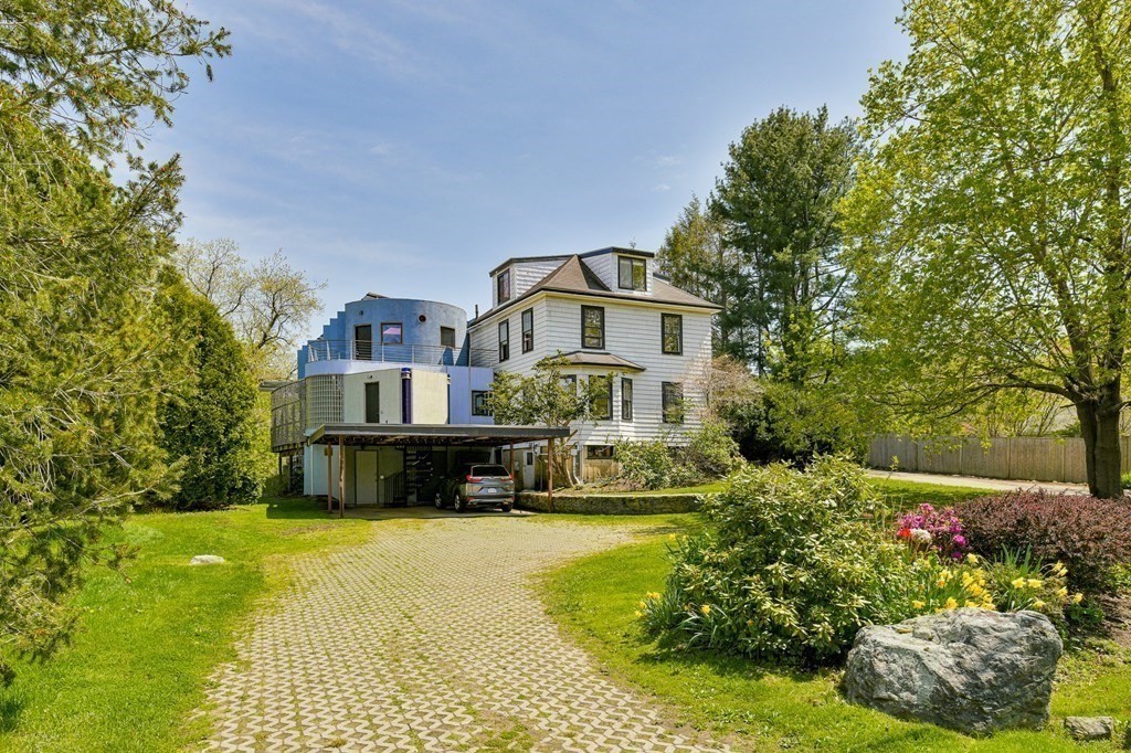 75 Kendall Road Lexington, MA 02421 - Photo 22 of 22 a front view of a house with a yard and fountain