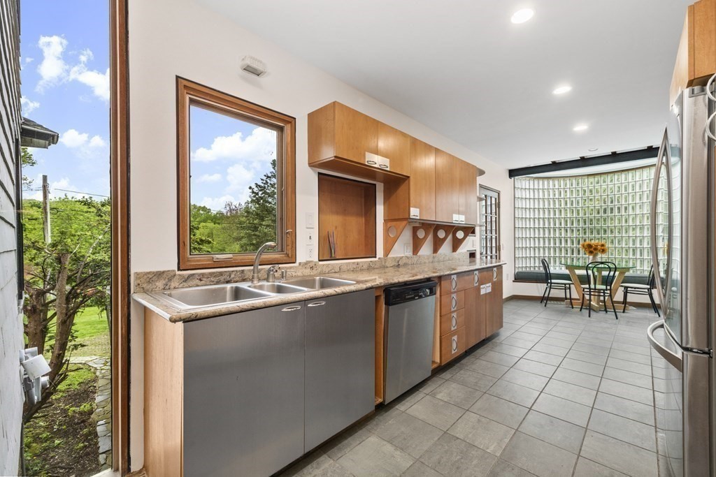 75 Kendall Road Lexington, MA 02421 - Photo 9 of 22 a kitchen with a sink and large window