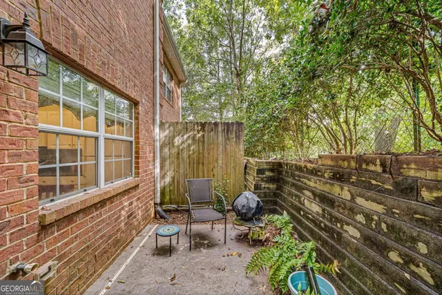 a backyard of a house with outdoor seating