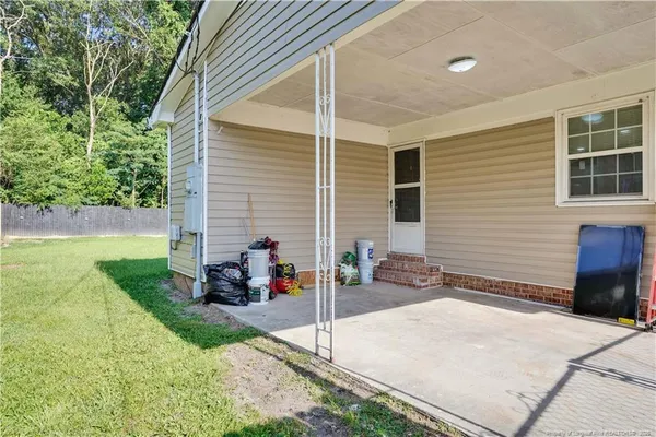 a view of a patio with chairs and table in a patio
