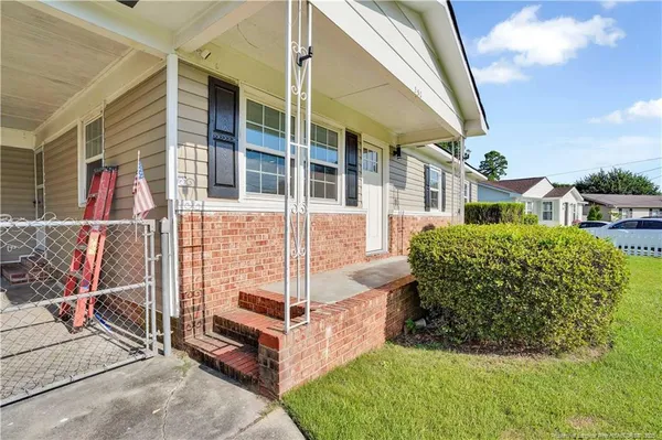 a view of a balcony with potted plants