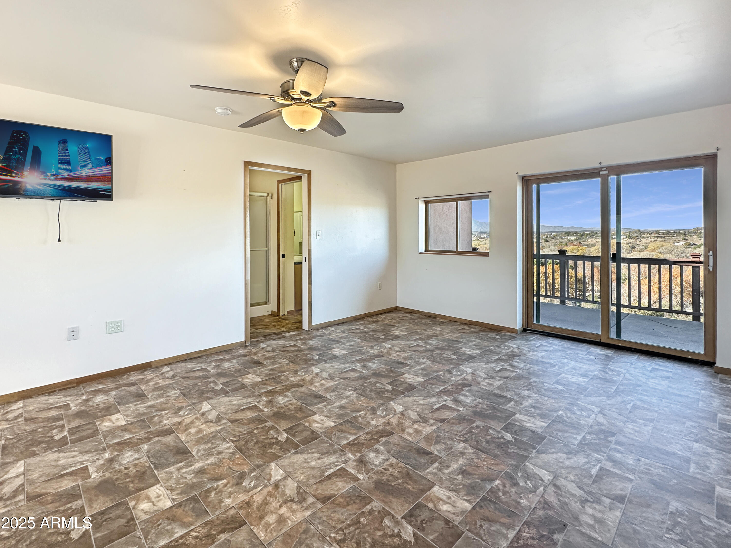 4580 Roundup Road Rimrock, AZ 86335 - Photo 13 of 21 a view of an empty room with window