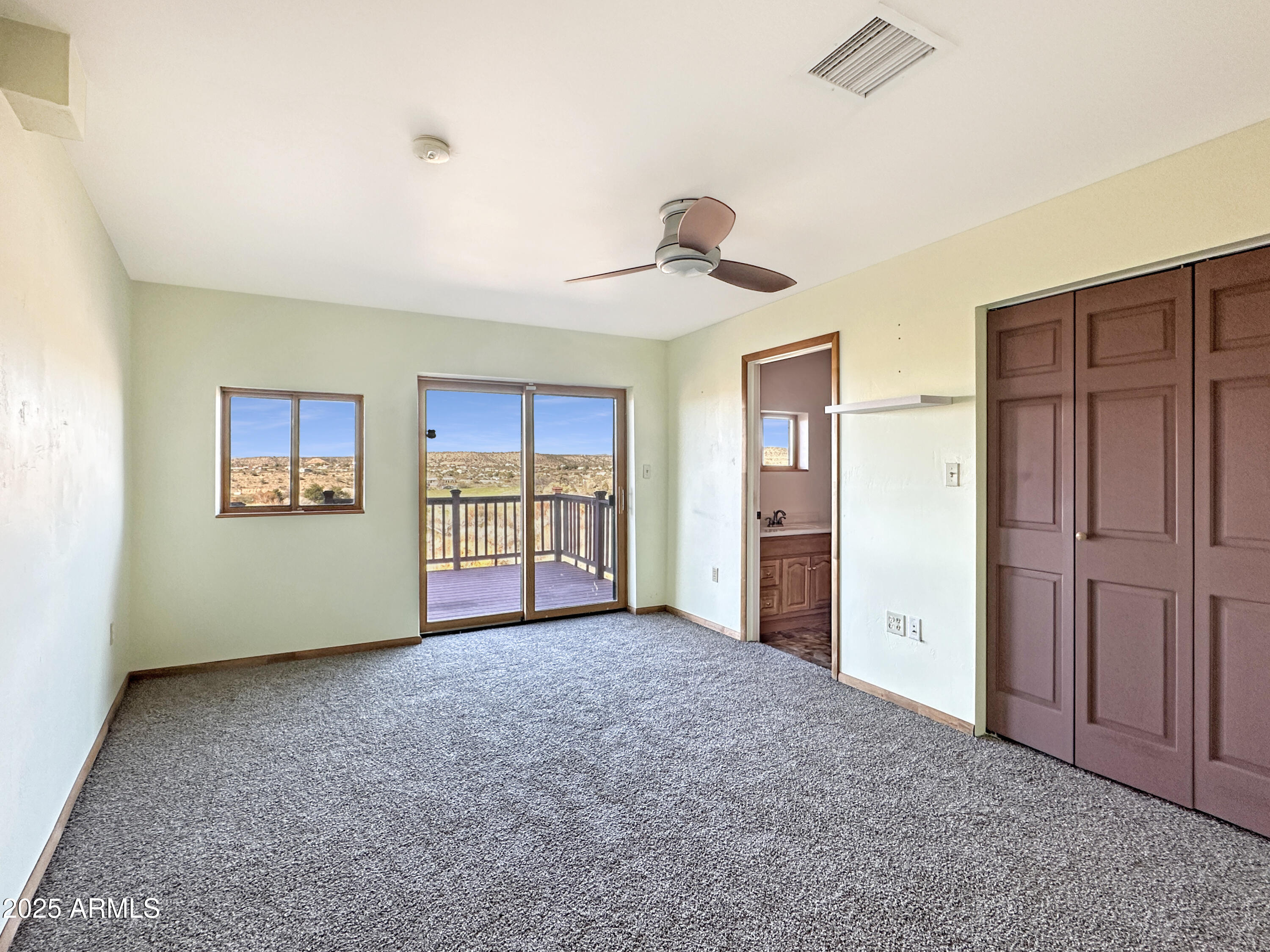 4580 Roundup Road Rimrock, AZ 86335 - Photo 18 of 21 a view of empty room with wooden floor and cabinet
