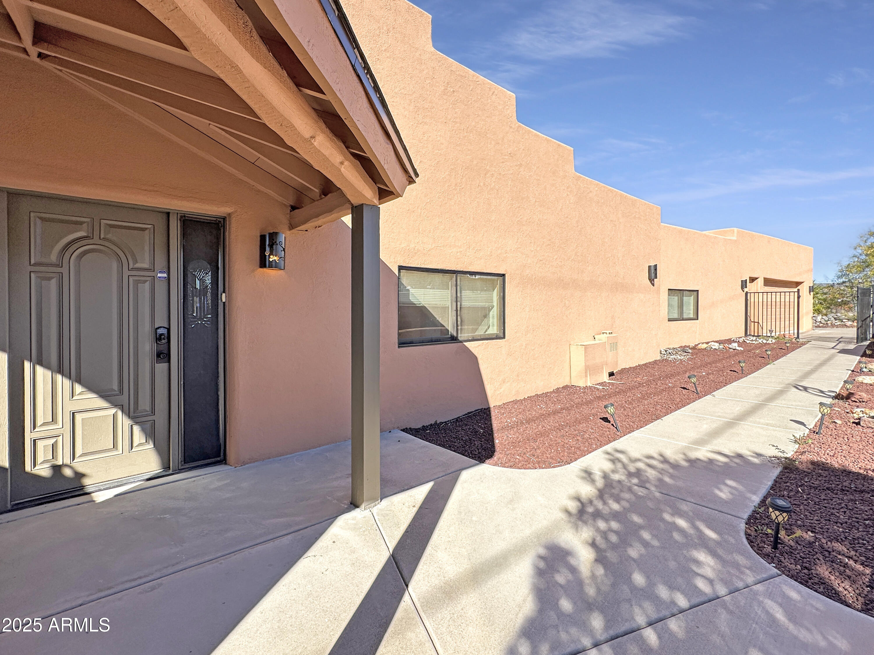 4580 Roundup Road Rimrock, AZ 86335 - Photo 7 of 21 a bedroom with a large bed and a large window