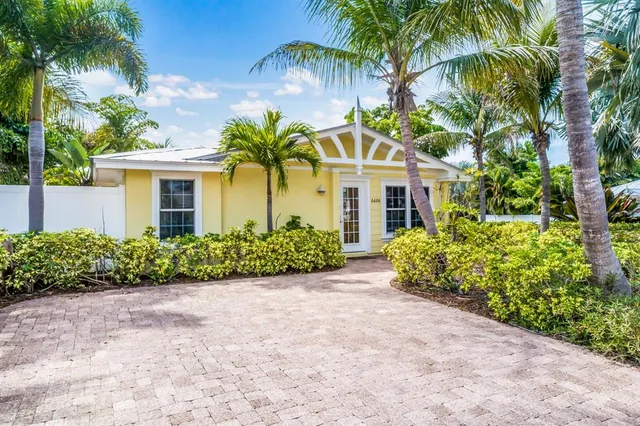 front view of a house with a garden