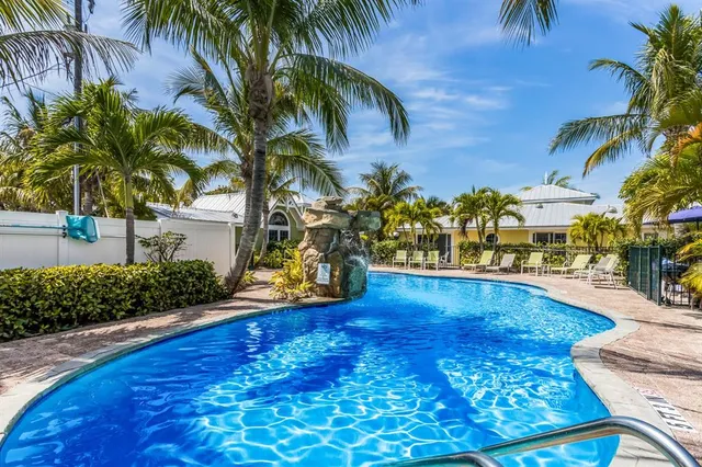 a view of a swimming pool with a garden