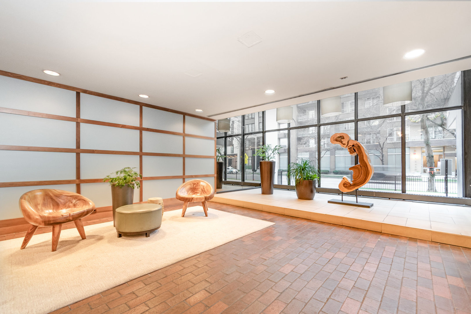 5445 North Sheridan Road, Unit 2306 Chicago, IL 60640 - Photo 18 of 25 a living room with furniture and a floor to ceiling window