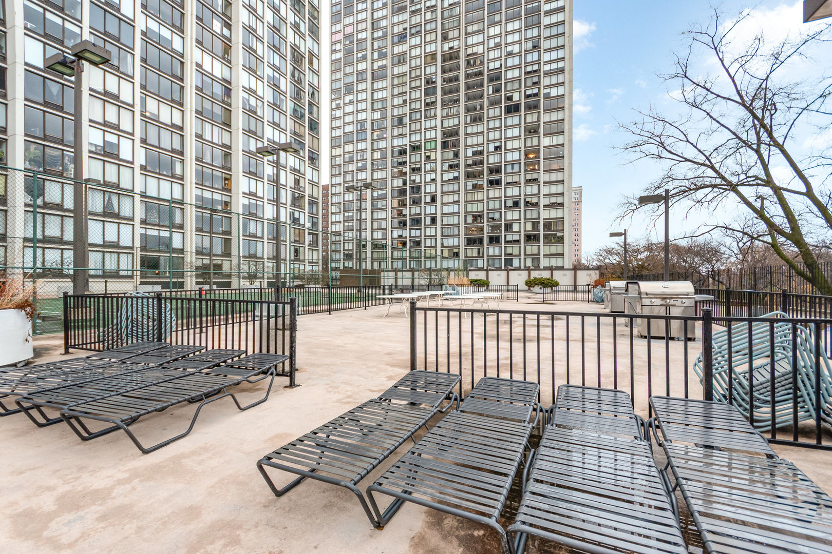 5445 North Sheridan Road, Unit 2306 Chicago, IL 60640 - Photo 22 of 25 a outdoor space with lots of white furniture
