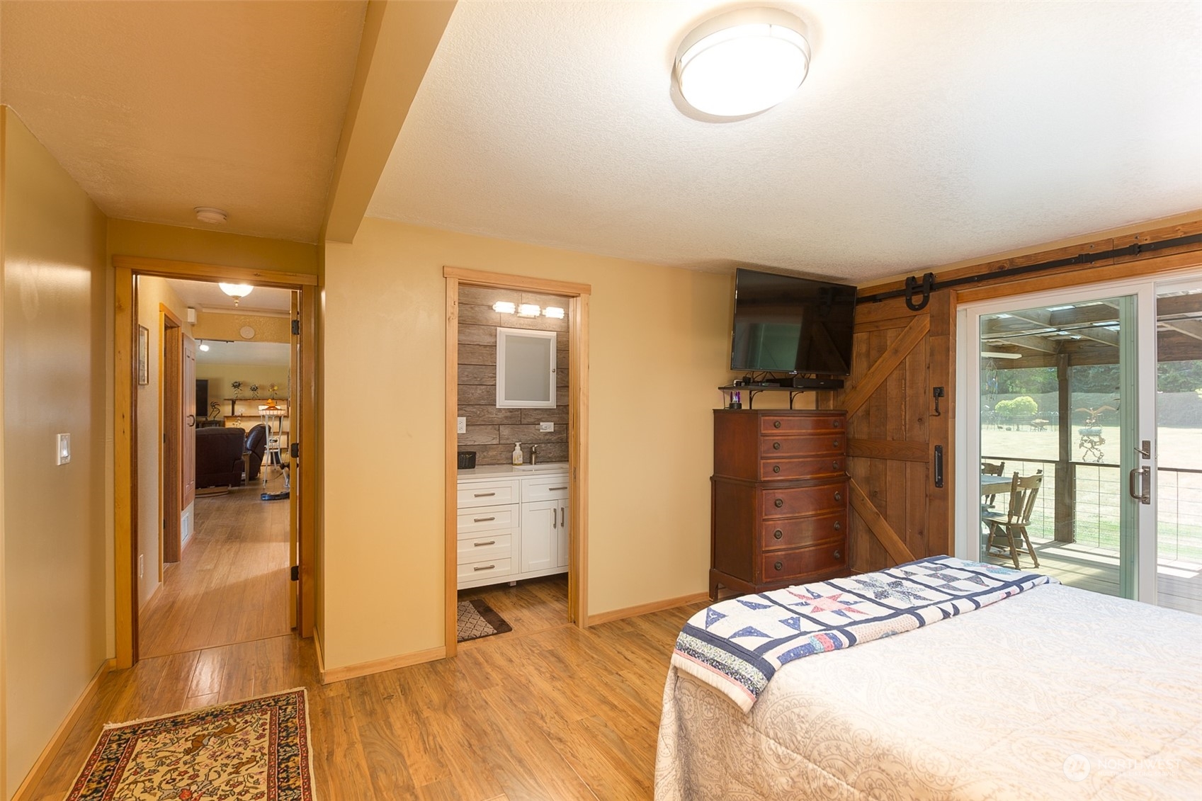 60 Klahhane Road Sequim, WA 98382 - Photo 11 of 36 a bedroom with a bed and a dresser