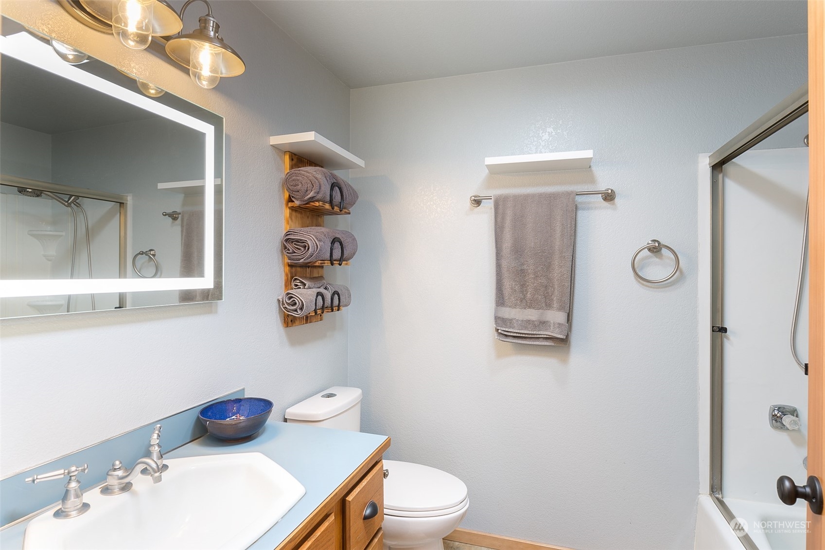 60 Klahhane Road Sequim, WA 98382 - Photo 17 of 36 a bathroom with a sink vanity mirror and toilet