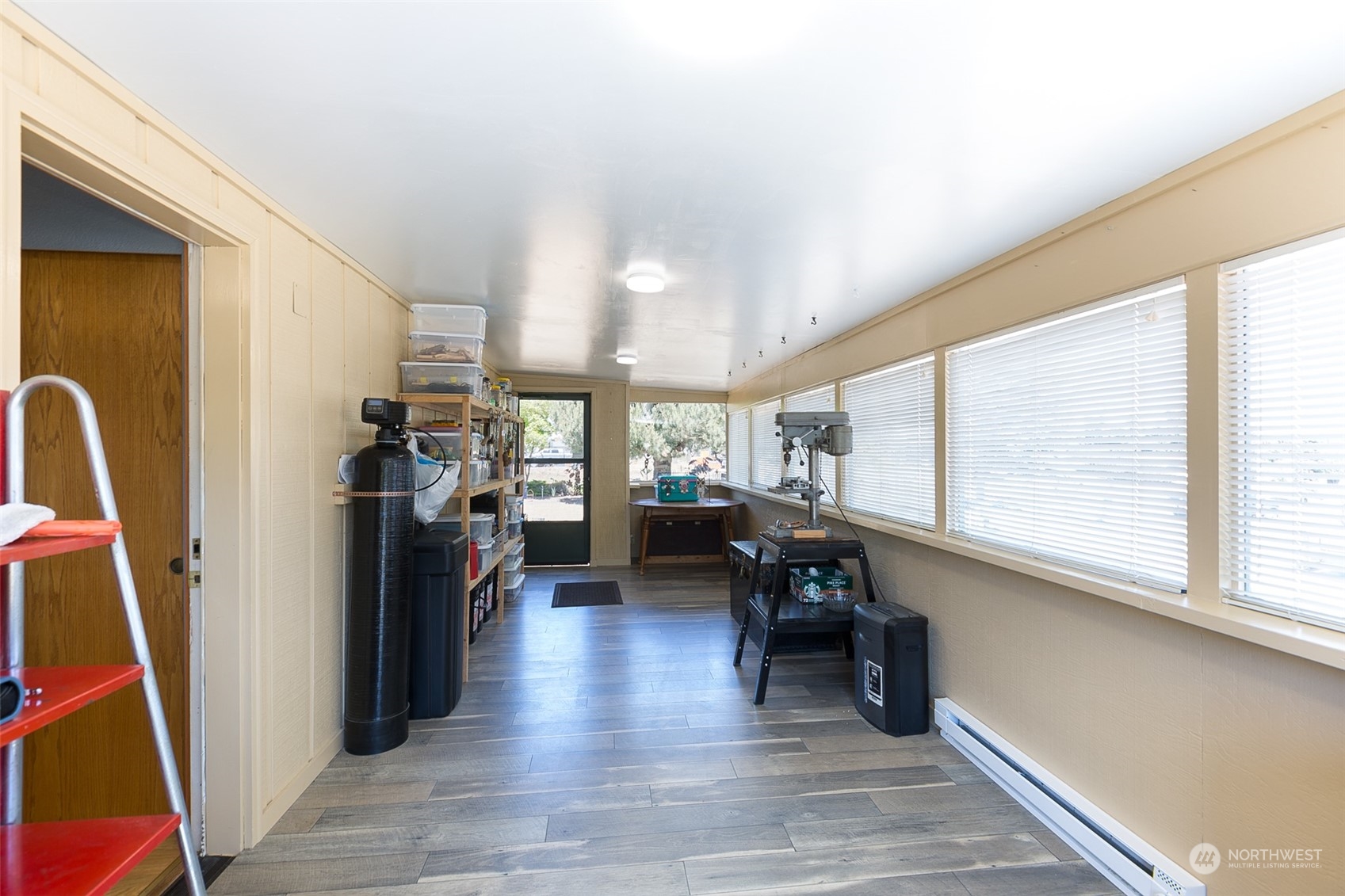 60 Klahhane Road Sequim, WA 98382 - Photo 19 of 36 a living room with furniture a large window and wooden floor