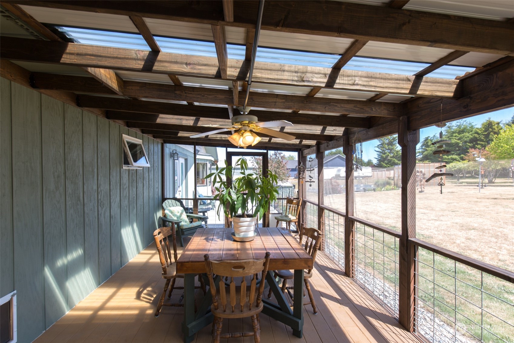 60 Klahhane Road Sequim, WA 98382 - Photo 22 of 36 a view of a dining room with furniture window and outside view