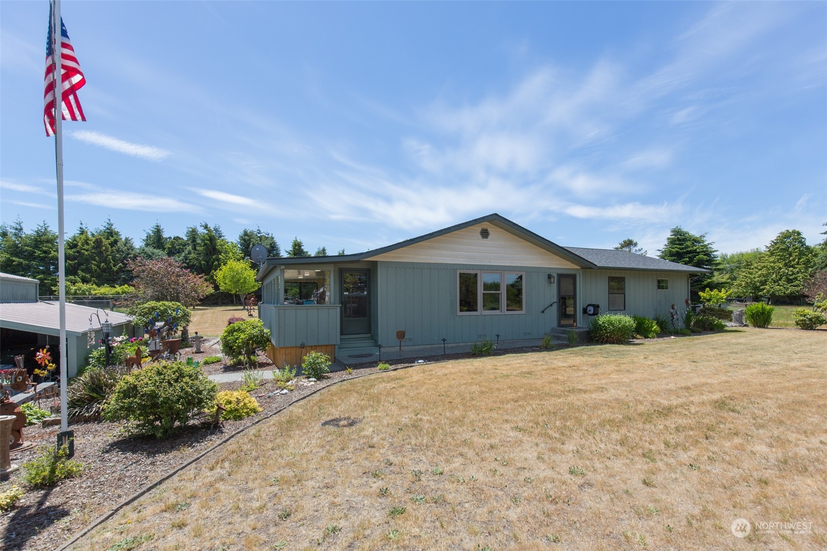 60 Klahhane Road Sequim, WA 98382 - Photo 35 of 36 a front view of a house with a yard and garage