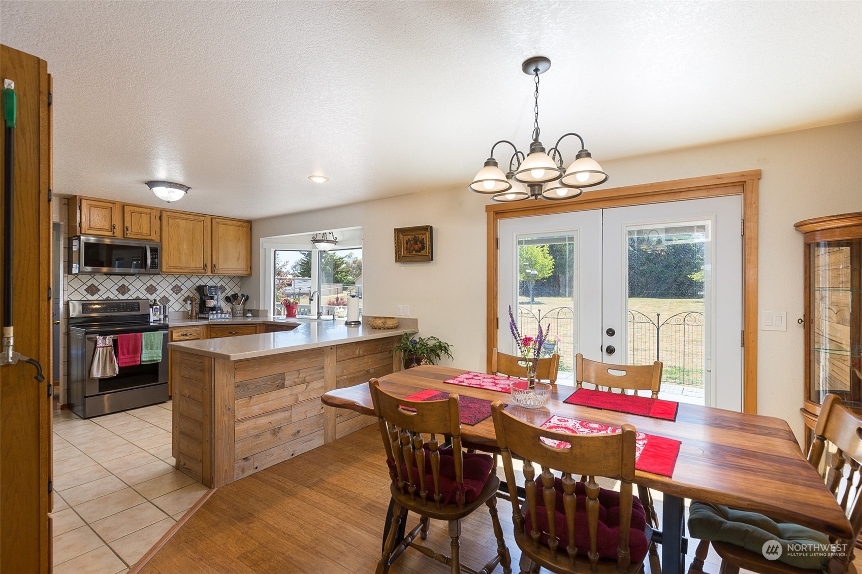 60 Klahhane Road Sequim, WA 98382 - Photo 6 of 36 a kitchen that has a table and chairs in it