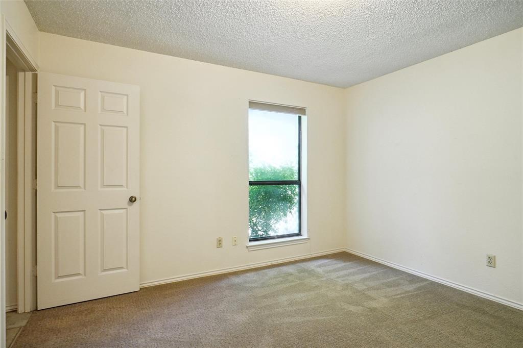 5717 Ridgerock Court Fort Worth, TX 76132 - Photo 16 of 20 an empty room with windows