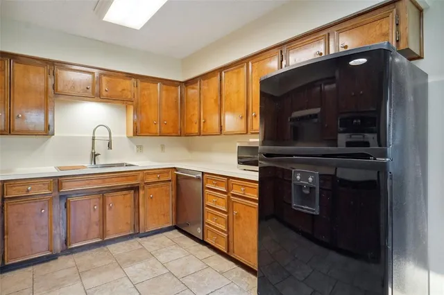 a kitchen with a sink and a stove