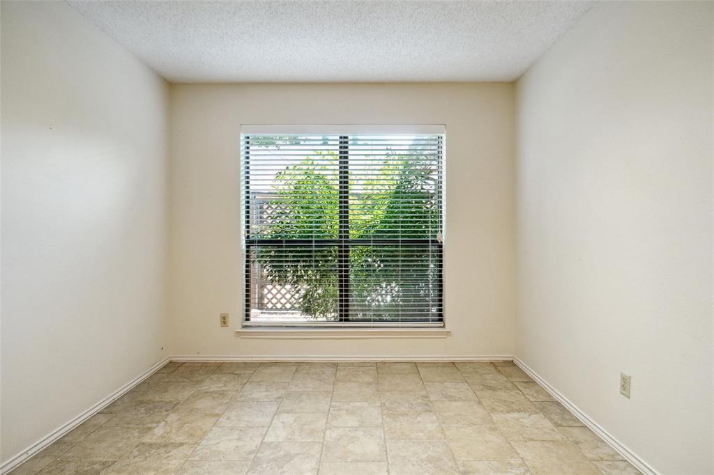 5717 Ridgerock Court Fort Worth, TX 76132 - Photo 10 of 20 a view of an empty room with a window