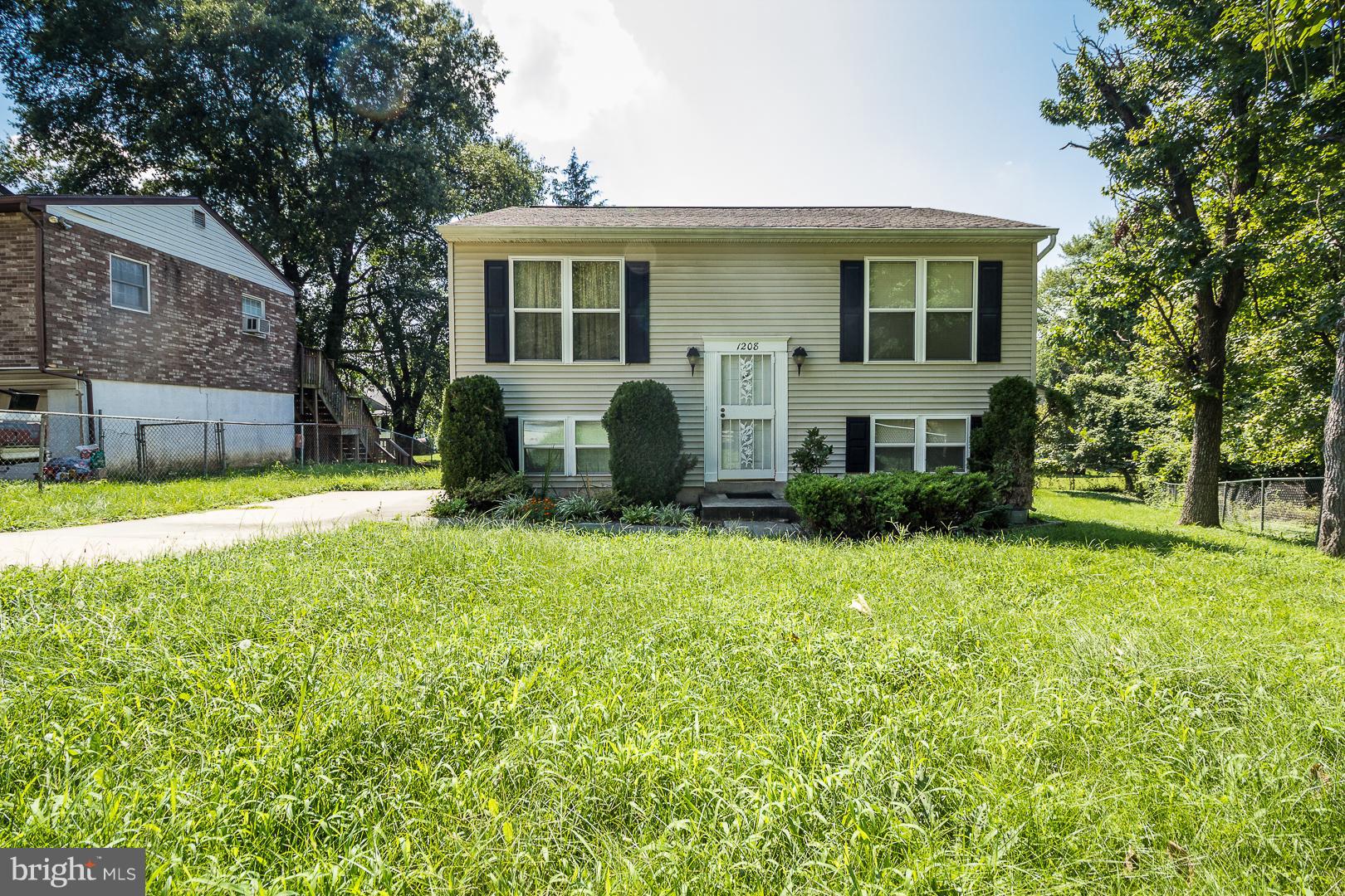 1208 Java Place Landover, MD 20785 - Photo 1 of 19 a view of a house with backyard and a tree