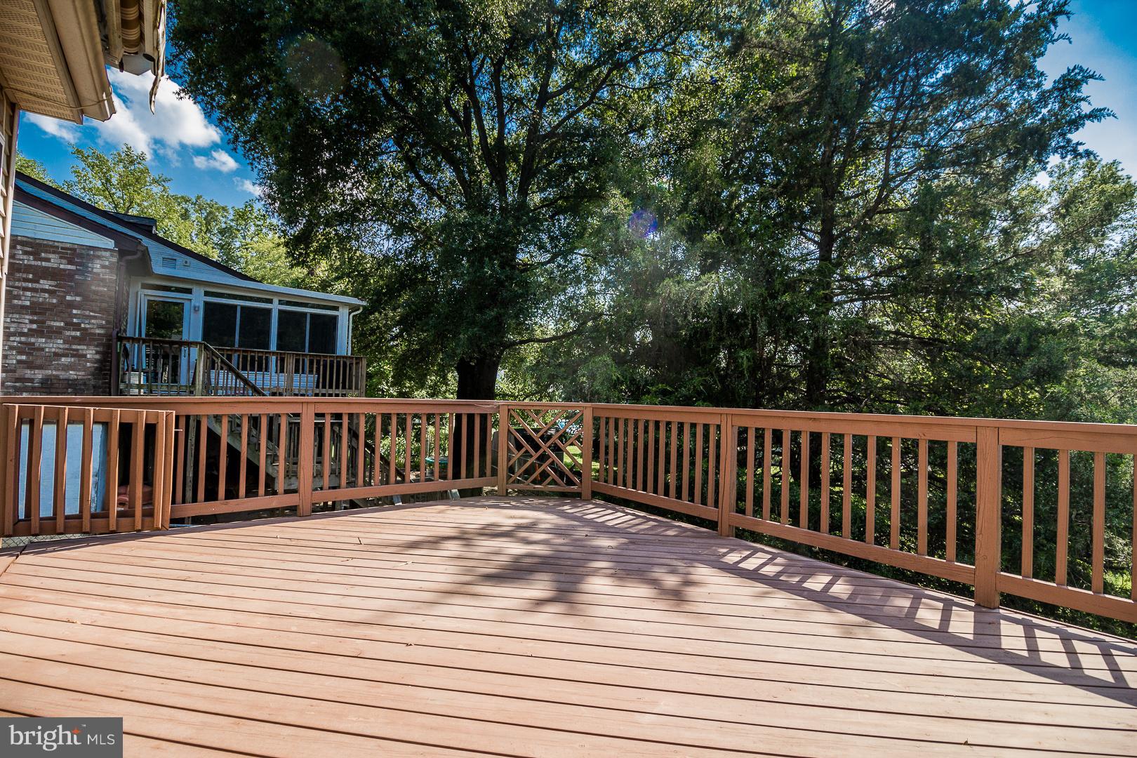 1208 Java Place Landover, MD 20785 - Photo 16 of 19 a view of deck with wooden floor and fence