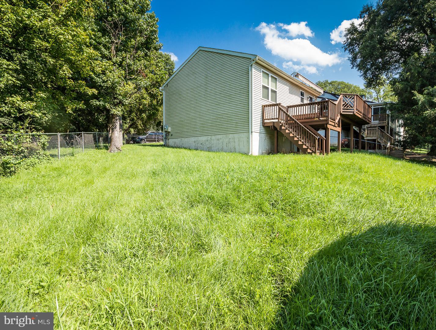 1208 Java Place Landover, MD 20785 - Photo 17 of 19 a backyard of a house with lots of green space