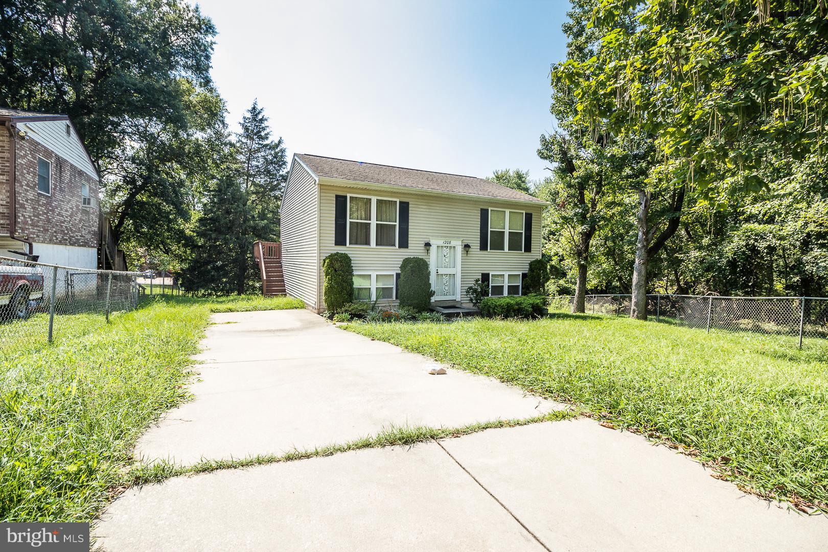 1208 Java Place Landover, MD 20785 - Photo 19 of 19 a front view of house with yard and green space