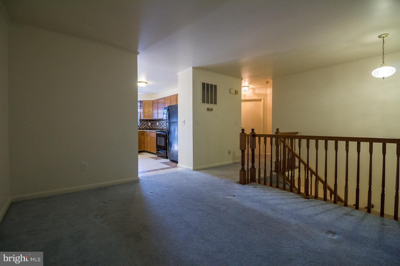 1208 Java Place Landover, MD 20785 - Photo 4 of 19 a view of a hallway with wooden shelves