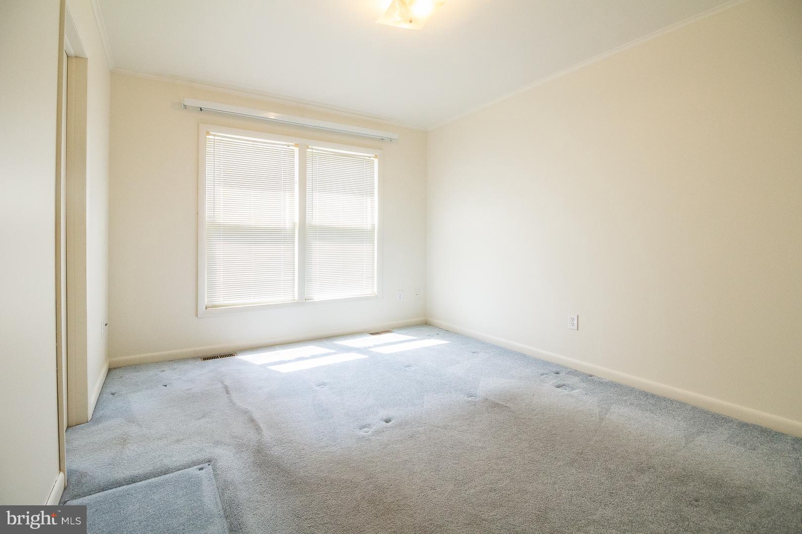 1208 Java Place Landover, MD 20785 - Photo 7 of 19 an empty room with a window