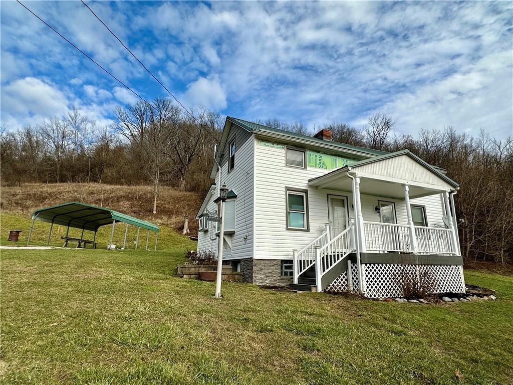 128 Buckland Road Wind Ridge, PA 15380 - Photo 3 of 34 a view of a house with a yard