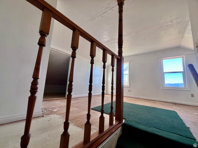 479 East 100 N Road Meadow, UT 84644 - Photo 22 of 59 Additional living space featuring baseboards and lofted ceiling