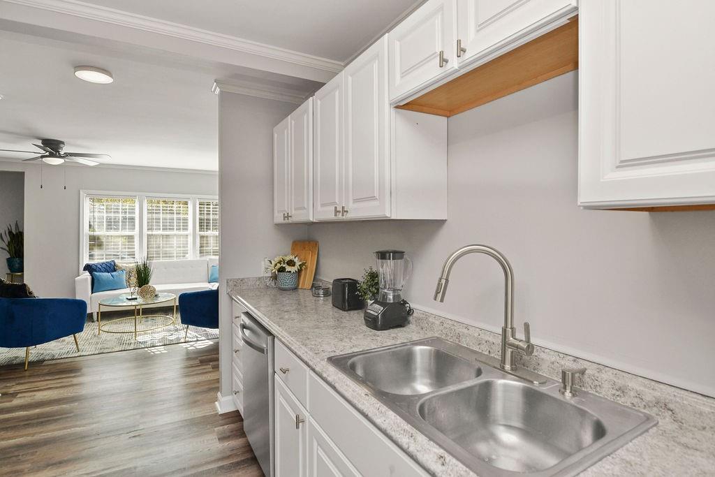 1917 Spring Avenue Atlanta, GA 30344 - Photo 9 of 22 a kitchen with sink a stove and cabinets