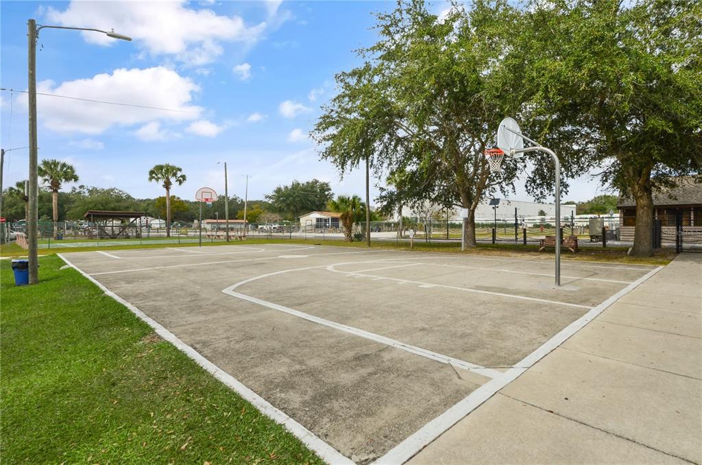 3000 Clarcona Road, Unit 1218 Apopka, FL 32703 - Photo 18 of 22 a view of a playground with basketball court