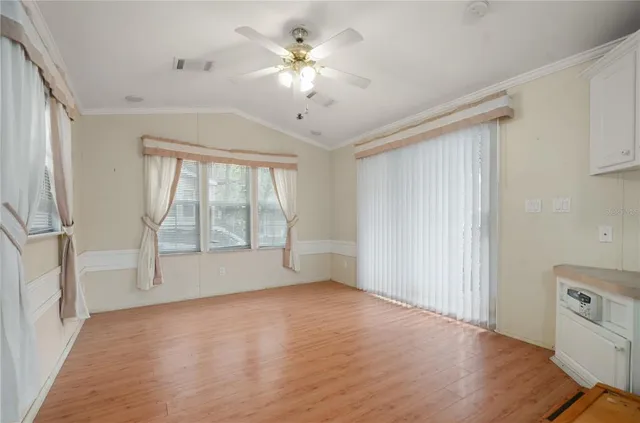 a view of an empty room with a window