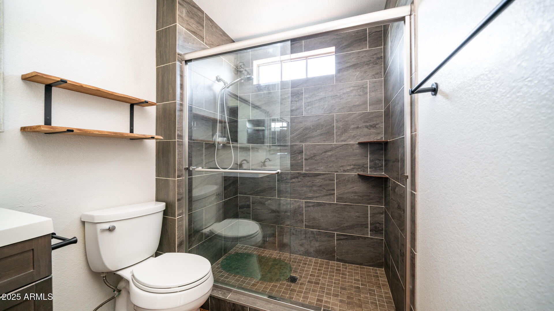 2020 West Union Hills Drive, Unit 246 Phoenix, AZ 85027 - Photo 21 of 23 a bathroom with a toilet and a shower